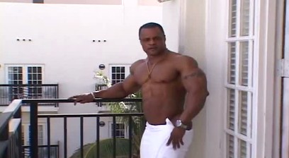 Silvio Samuel Flexing and Posing On A Balcony