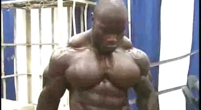 Johnnie Jackson Lifting Weights And Then Posing In Trunks