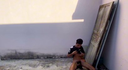 Skinny guy with a big dick jerking off in the street