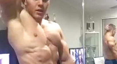 cute jock flexes ripped muscles