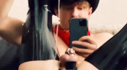 a cowboy is caged and fucked by a machine