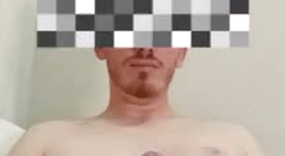 Redhead man with a gift enjoying himself solo on the web