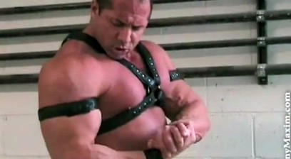 Tony Maxim Flexing and Posing Wearing A Leather Harness And Armbands